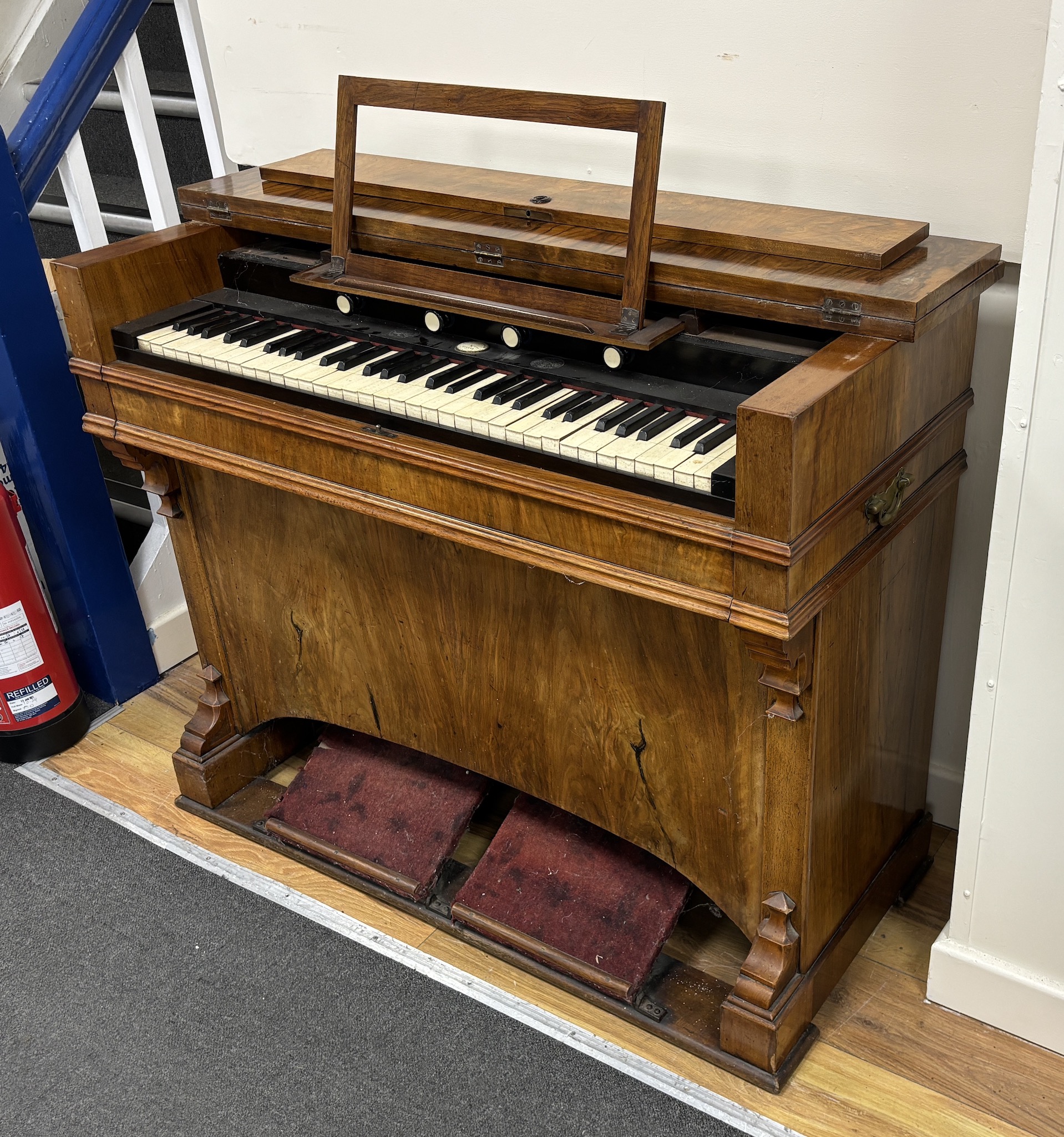 A Victorian walnut harmonium, width 106cm, depth 49cm, height 88cm